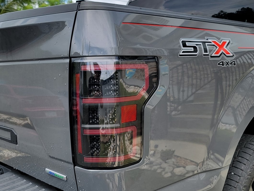 Raxiom LED Tail Lights; Black Housing; Clear Lens (18-20 F-150 w/ Factory Halogen Non-BLIS Tail Lights)
