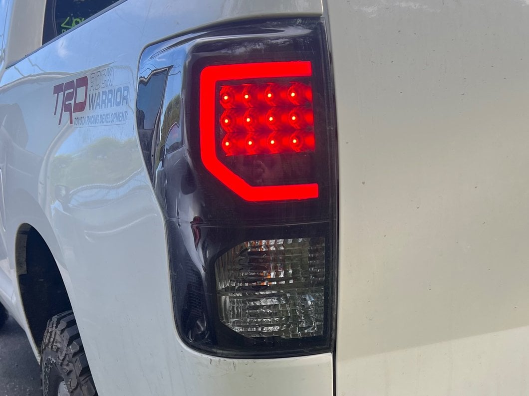 Raxiom Axial Series Dual C-Shape LED Tail Lights; Black Housing; Smoked Lens (07-13 Tundra)