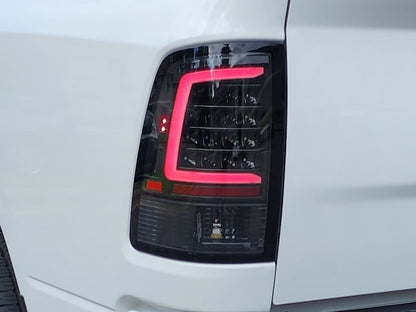 Raxiom Axial Series LED Tail Lights; Black Housing; Clear Lens (09-18 RAM 1500 w/ Factory Halogen Tail Lights)