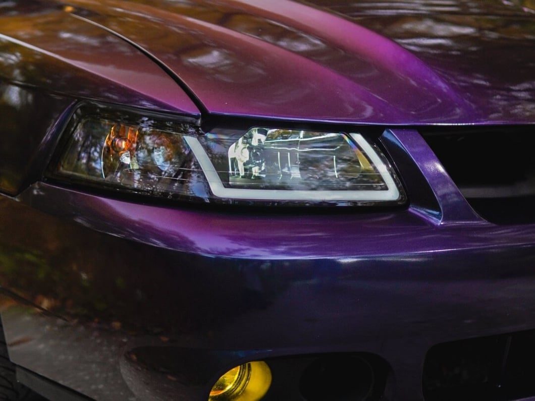 Raxiom Axial Series Headlights with Sequential LED Bar; Black Housing; Clear Lens (99-04 Mustang)