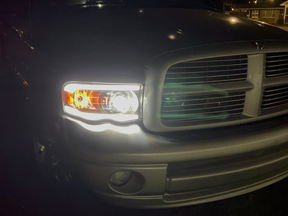 Raxiom Axial Series LED Projector Headlights with Sequential LED Bar; Black Housing; Clear Lens (02-05 RAM 1500)