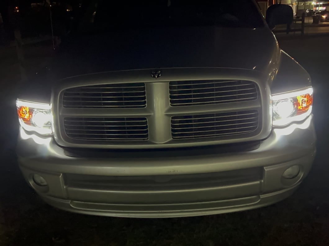 Raxiom Axial Series LED Projector Headlights with Sequential LED Bar; Black Housing; Clear Lens (02-05 RAM 1500)
