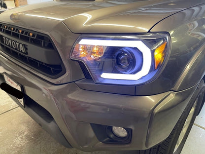 Raxiom Axial Series Projector Headlights with Sequential LED Bar; Black Housing; Clear Lens (12-15 Tacoma)