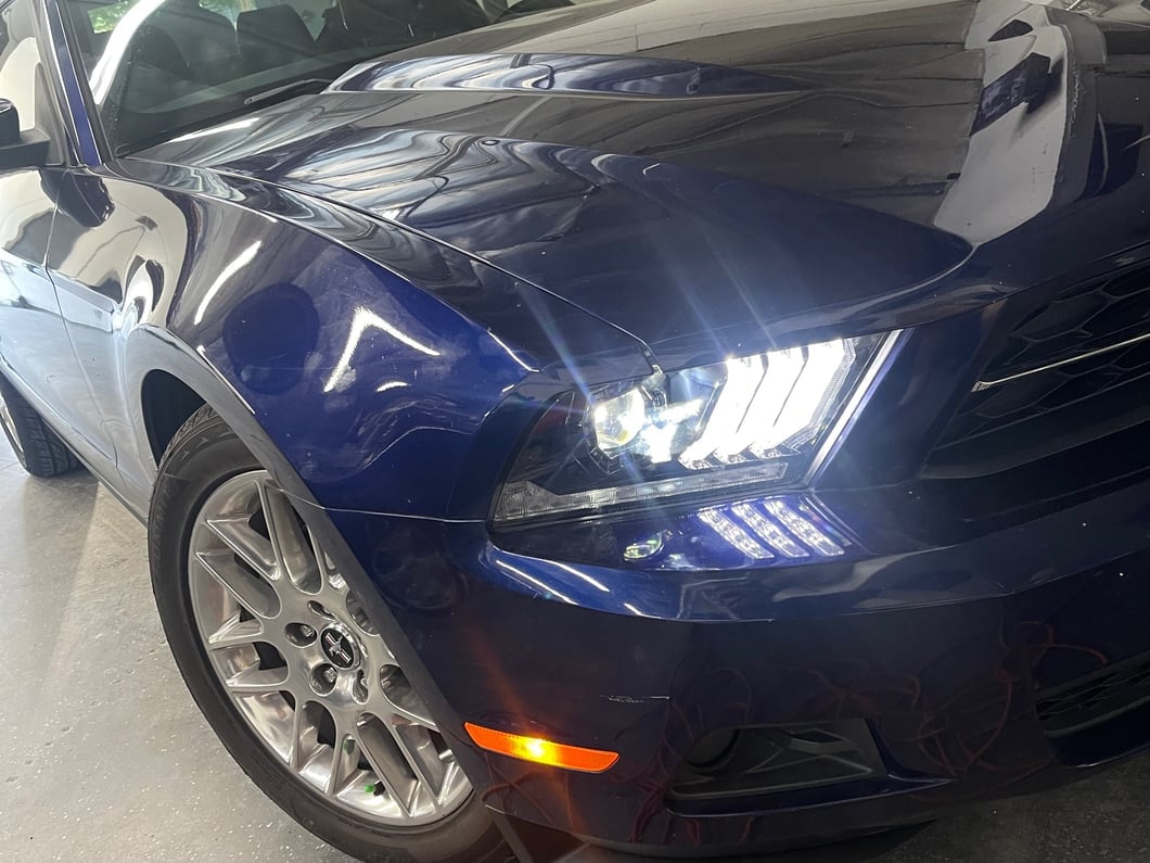 Raxiom LED Projector Headlights with DRL and Sequential Turn Signals; Black Housing; Clear Lens (10-12 Mustang w/ Factory Halogen Headlights)