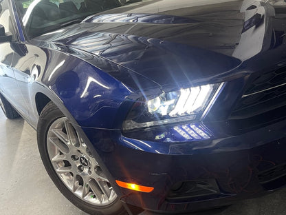 Raxiom LED Projector Headlights with DRL and Sequential Turn Signals; Black Housing; Clear Lens (10-12 Mustang w/ Factory Halogen Headlights)