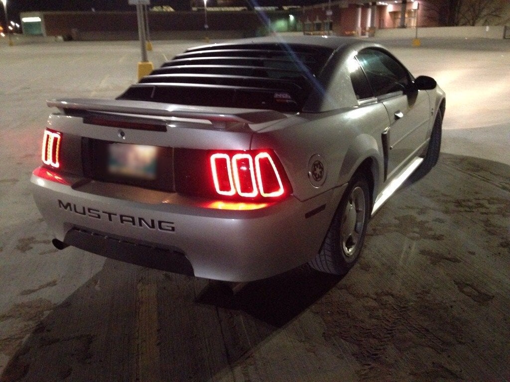 Raxiom Icon LED Tail Lights and Sequential Tail Light Kit; Black Housing; Smoked Lens (99-04 Mustang, Excluding 99-01 Cobra)