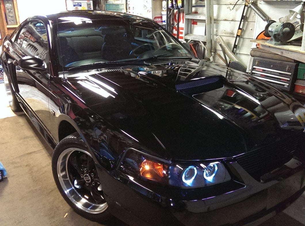 Raxiom Dual LED Halo Projector Headlights; Black Housing; Smoked Lens (99-04 Mustang)