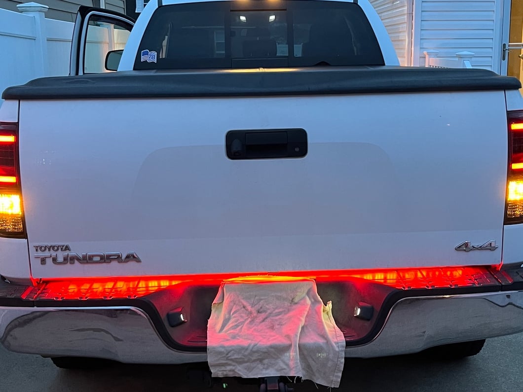 Raxiom Axial Series Dual C-Shape LED Tail Lights; Black Housing; Smoked Lens (07-13 Tundra)