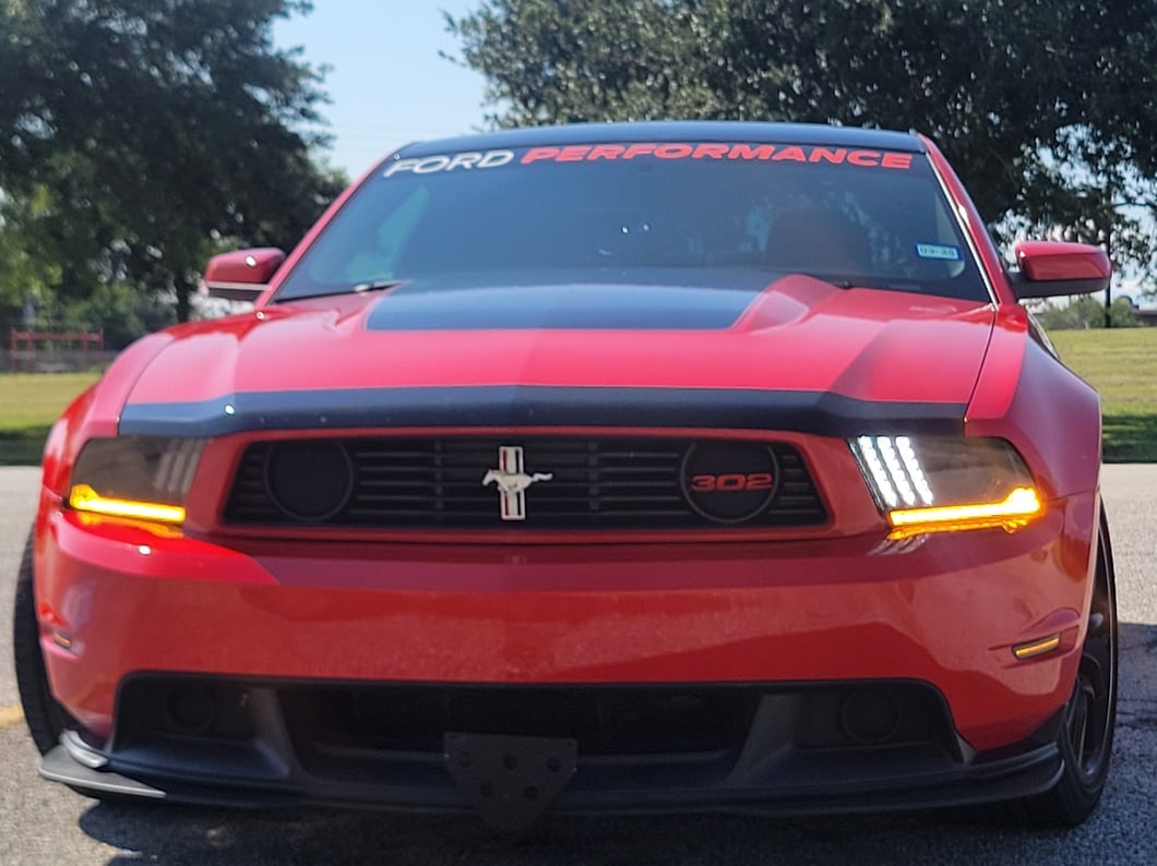 Raxiom LED Projector Headlights with DRL and Sequential Turn Signals; Black Housing; Clear Lens (10-12 Mustang w/ Factory Halogen Headlights)