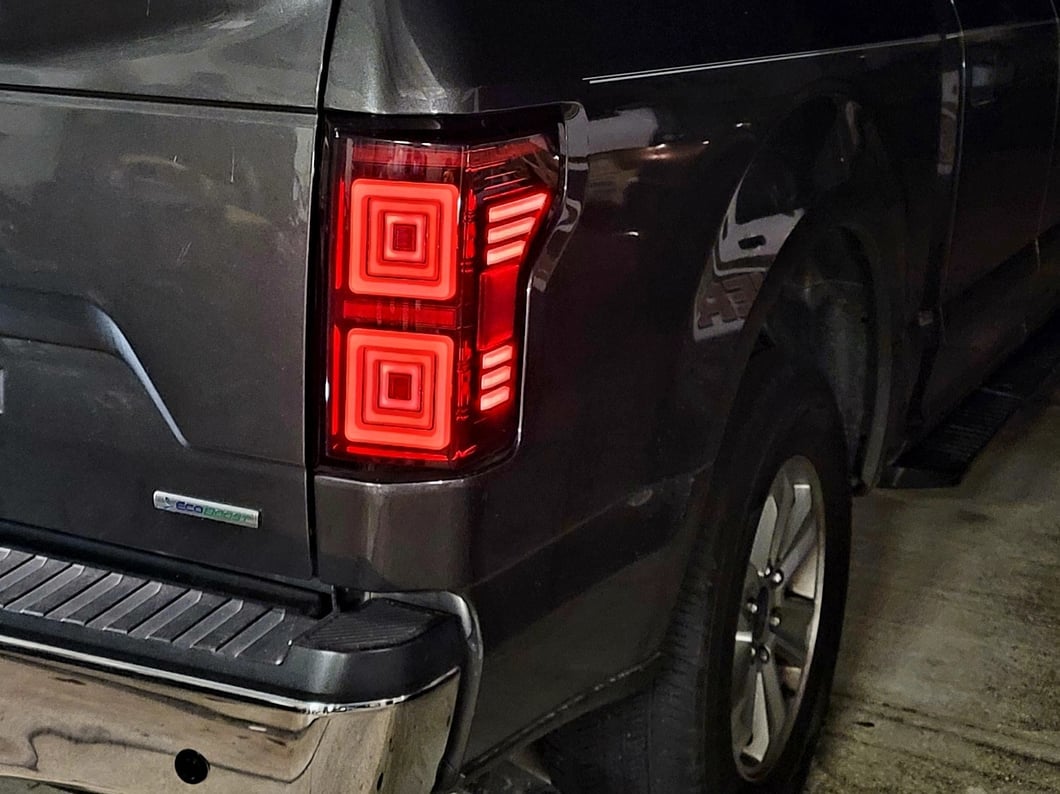 Raxiom Horizon LED Tail Lights; Black Housing; Clear Lens (15-20 F-150 w/ Factory Halogen Non-BLIS Tail Lights)