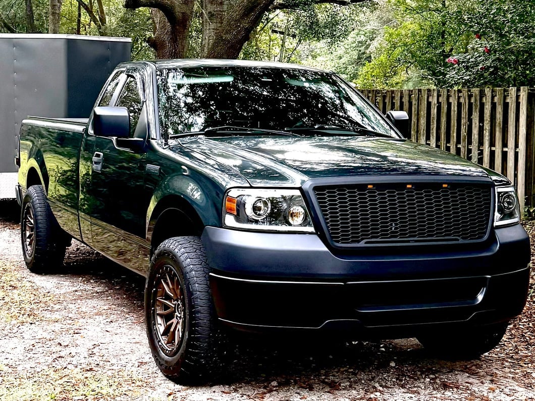 Raxiom Axial Series LED Projector Headlights with Sequential LED Bar; Black Housing; Clear Lens (04-08 F-150)