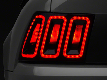 Raxiom Icon LED Tail Lights and Sequential Tail Light Kit; Black Housing; Smoked Lens (99-04 Mustang, Excluding 99-01 Cobra)