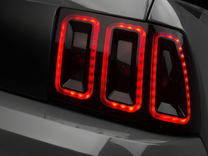 Raxiom Icon LED Tail Lights and Sequential Tail Light Kit; Black Housing; Smoked Lens (99-04 Mustang, Excluding 99-01 Cobra)