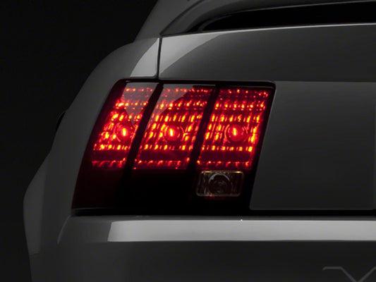 Raxiom Tail Lights; Black Housing; Smoked Lens (99-04 Mustang, Excluding 99-01 Cobra)