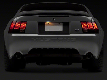 Raxiom Tail Lights; Black Housing; Smoked Lens (99-04 Mustang, Excluding 99-01 Cobra)