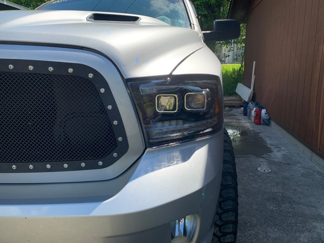 Raxiom LED Projector Headlights with Switchback Turn Signals; Black Housing; Clear Lens (09-18 RAM 1500 w/ Factory Halogen Non-Projector Headlights)