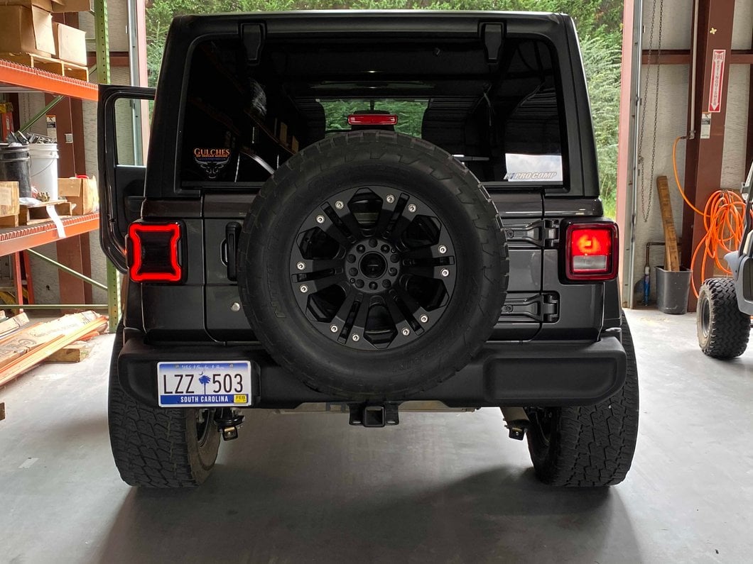 Raxiom LED Tail Lights; Black Housing; Smoked Lens (18-25 Jeep Wrangler JL w/ Factory Halogen Tail Lights & w/o Blind Spot Detection)