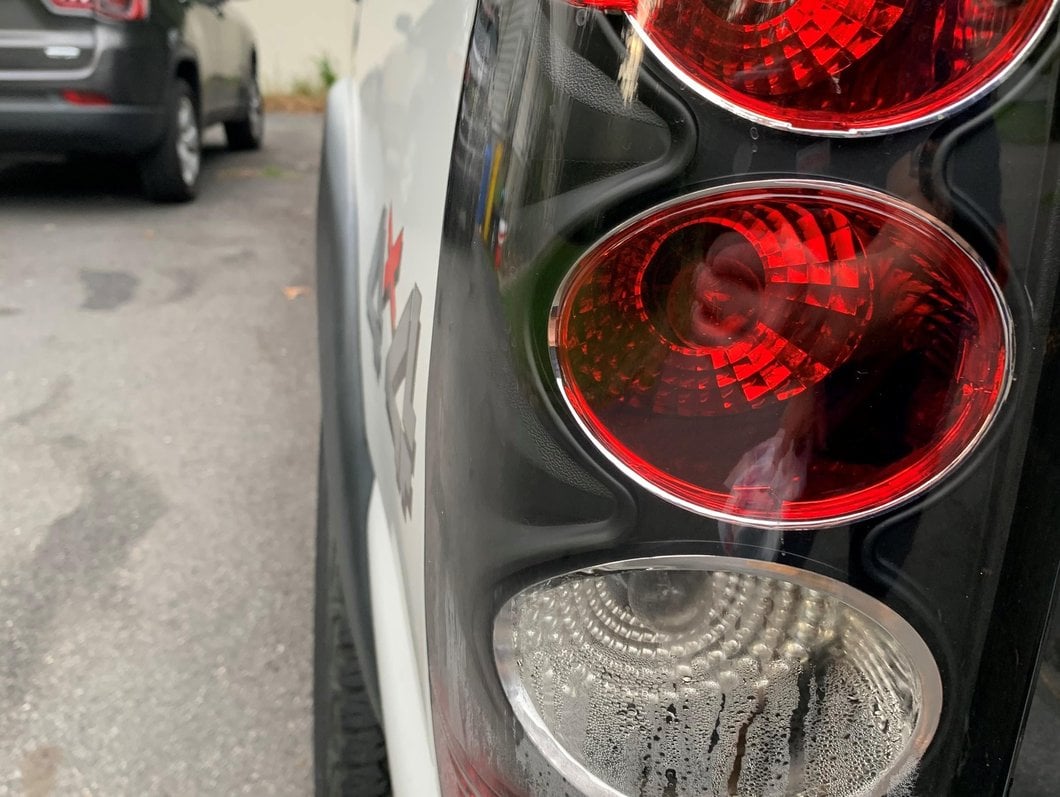 Raxiom Axial Series Tail Lights; Black Housing; Clear Lens (03-06 Silverado 1500 Fleetside)