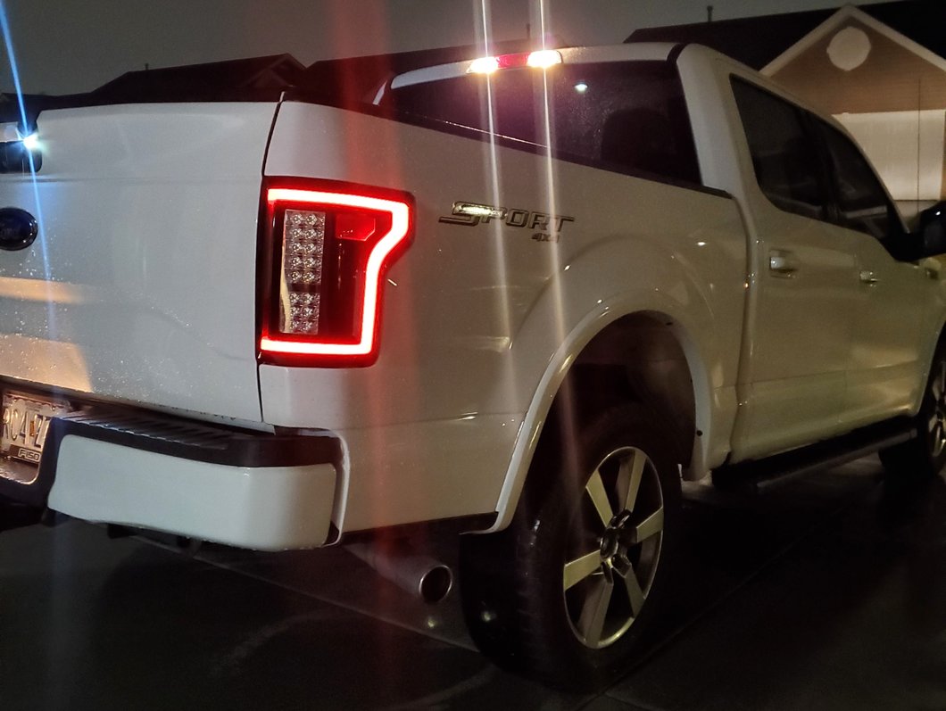 Raxiom LED Tail Lights; Black Housing; Clear Lens (15-17 F-150 w/ Factory Halogen Non-BLIS Tail Lights)