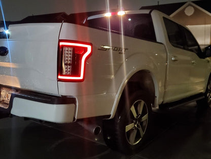 Raxiom LED Tail Lights; Black Housing; Clear Lens (15-17 F-150 w/ Factory Halogen Non-BLIS Tail Lights)