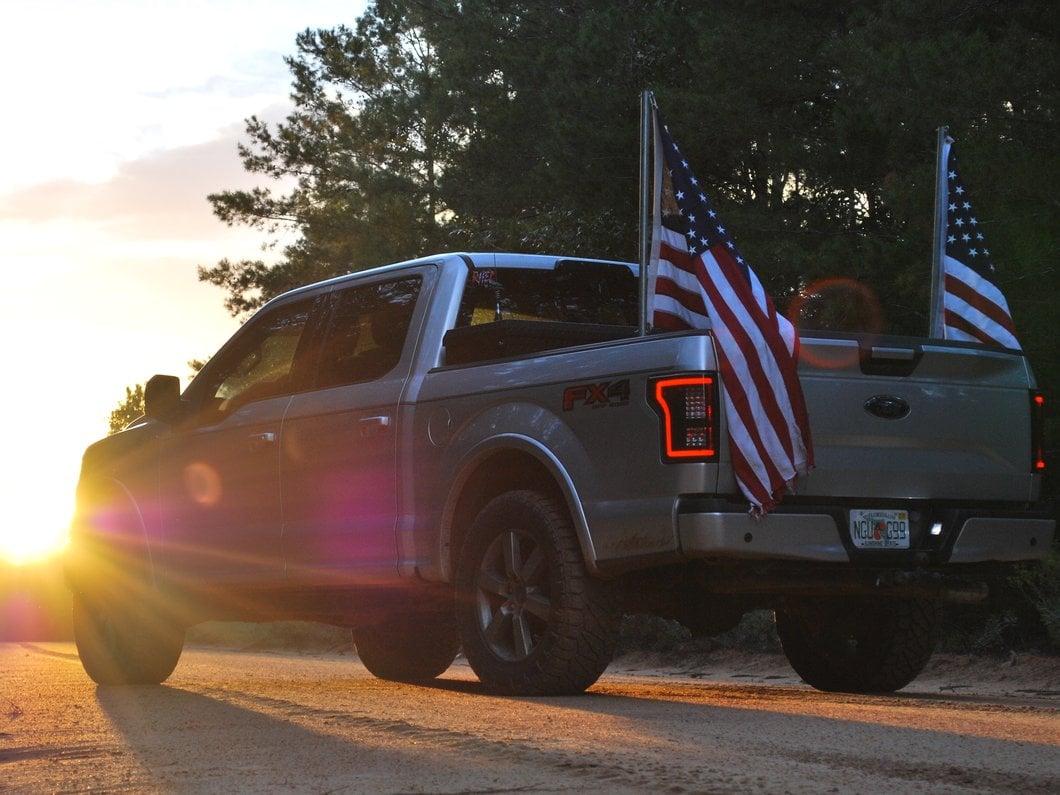 Raxiom LED Tail Lights with Sequential Turn Signals; Black Housing; Smoked Lens (15-17 F-150 w/ Factory Halogen Non-BLIS Tail Lights)