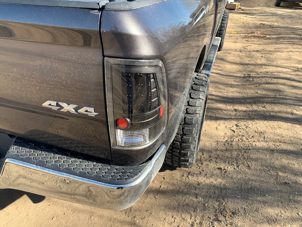 Raxiom LED Tail Lights; Black Housing; Clear Lens (09-18 RAM 1500 w/ Factory Halogen Tail Lights)