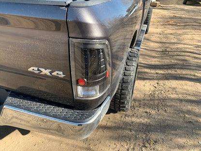 Raxiom LED Tail Lights; Black Housing; Clear Lens (09-18 RAM 1500 w/ Factory Halogen Tail Lights)
