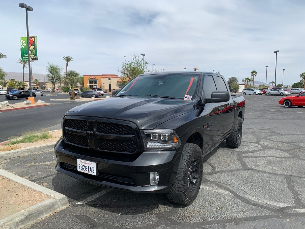 Raxiom LED Projector Headlights with Switchback Turn Signals; Black Housing; Clear Lens (09-18 RAM 1500 w/ Factory Halogen Non-Projector Headlights)