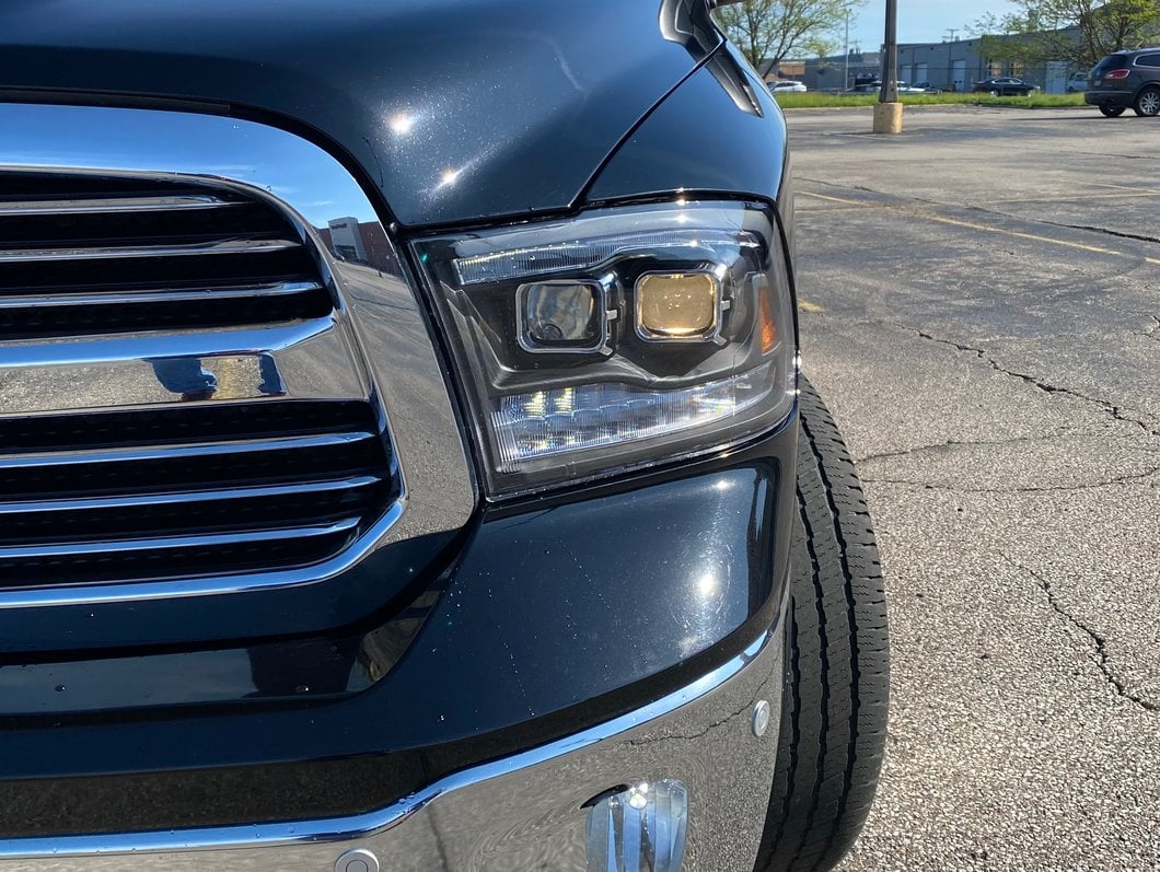 Raxiom LED Tail Lights; Black Housing; Clear Lens (09-18 RAM 1500 w/ Factory Halogen Tail Lights)