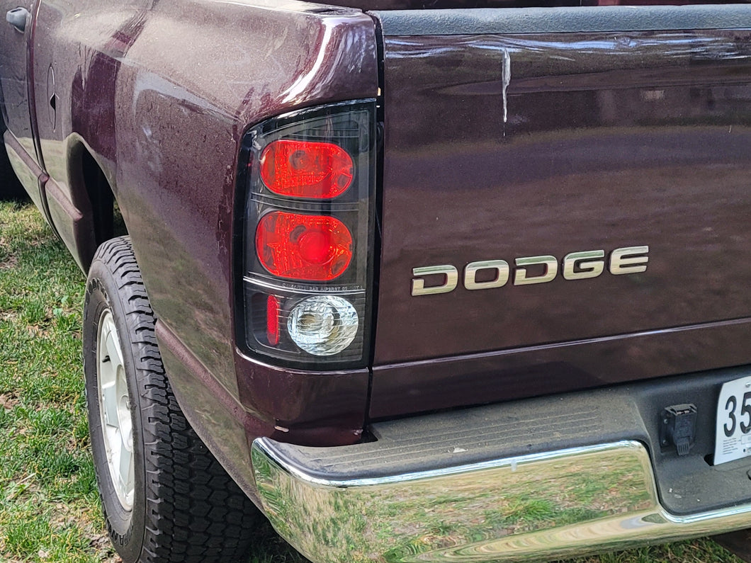Raxiom Axial Series Tail Lights; Black Housing; Red/Clear Lens (02-05 RAM 1500)