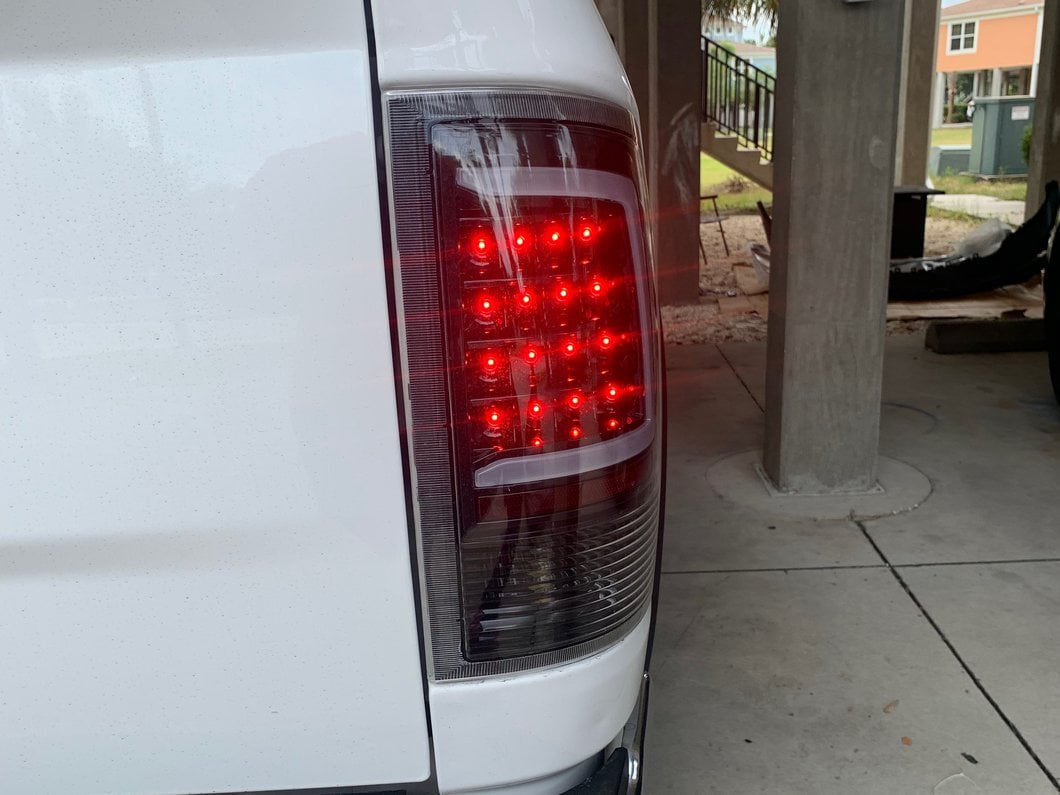 Raxiom Axial Series LED Tail Lights; Black Housing; Clear Lens (09-18 RAM 1500 w/ Factory Halogen Tail Lights)