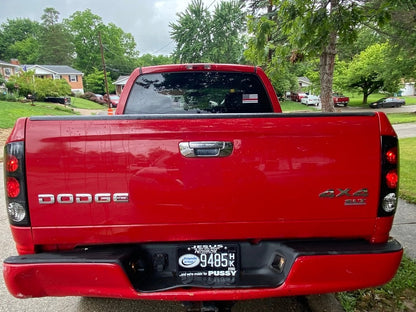 Raxiom Axial Series Tail Lights; Black Housing; Dark Smoked Lens (02-05 RAM 1500)