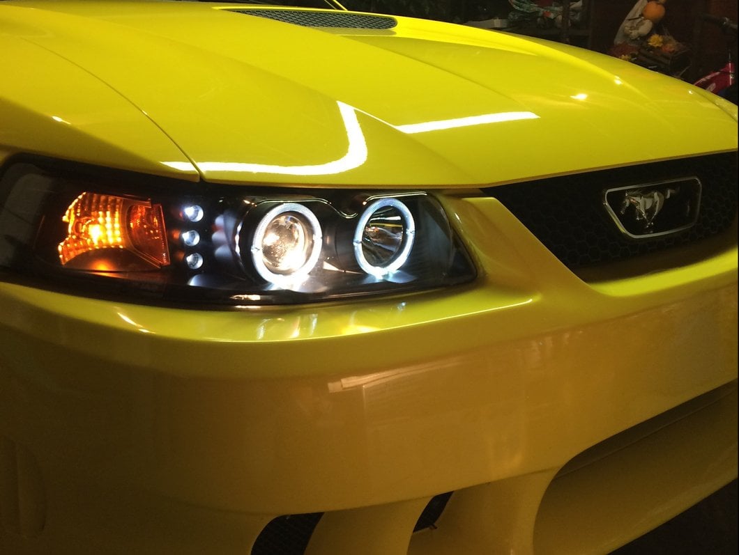 Raxiom Dual LED Halo Projector Headlights; Black Housing; Clear Lens (99-04 Mustang)