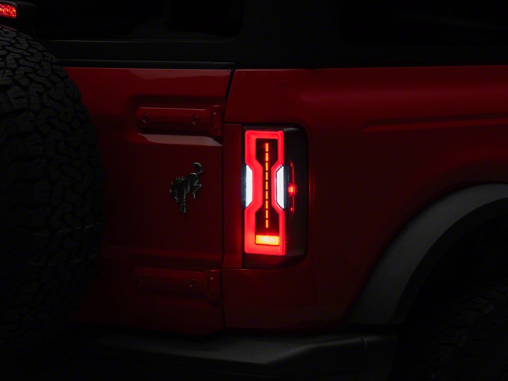 Raxiom Axial Series LED Tail Lights; Black Housing; Clear Lens (21-25 Bronco w/ Factory Halogen Tail Lights)