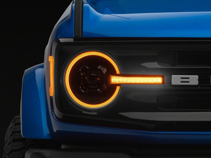 Raxiom LED Halo Headlights with Amber Backlight; Black Housing; Clear Lens (21-25 Bronco)