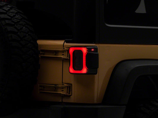 Raxiom Axial Series Carver LED Tail Lights; Black Housing; Smoked Lens (07-18 Jeep Wrangler JK)