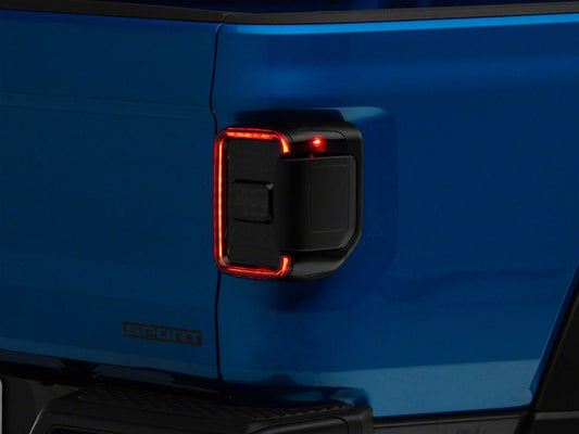 Raxiom LED Tail Lights; Black Housing; Smoked Lens (20-25 Jeep Gladiator JT w/ Factory Halogen Tail Lights & w/o Blind Spot Detection))