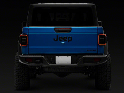 Raxiom LED Tail Lights; Black Housing; Smoked Lens (20-25 Jeep Gladiator JT w/ Factory Halogen Tail Lights & w/o Blind Spot Detection))