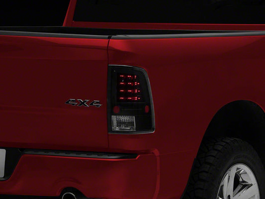 Raxiom LED Tail Lights; Black Housing; Clear Lens (09-18 RAM 1500 w/ Factory Halogen Tail Lights)