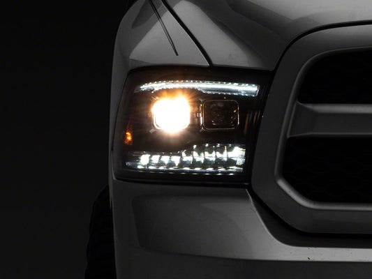 Raxiom LED Projector Headlights with Switchback Turn Signals; Black Housing; Clear Lens (09-18 RAM 1500 w/ Factory Halogen Non-Projector Headlights)