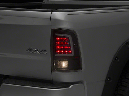 Raxiom Axial Series LED Tail Lights; Black Housing; Clear Lens (09-18 RAM 1500 w/ Factory Halogen Tail Lights)