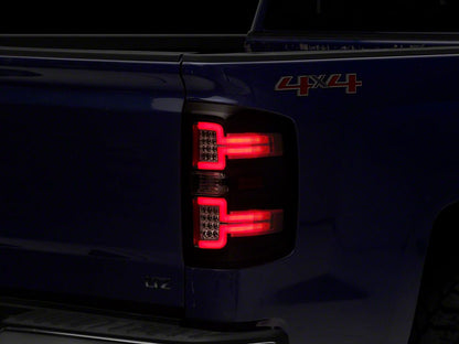 Raxiom LED Tail Lights with Sequential Turn Signals; Black Housing; Clear Lens (14-18 Silverado 1500 w/ Factory Halogen Tail Lights)