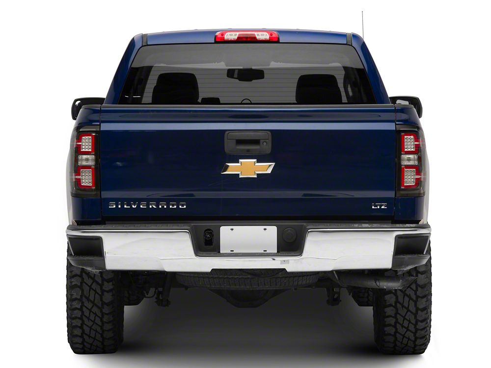Raxiom LED Tail Lights with Sequential Turn Signals; Black Housing; Clear Lens (14-18 Silverado 1500 w/ Factory Halogen Tail Lights)