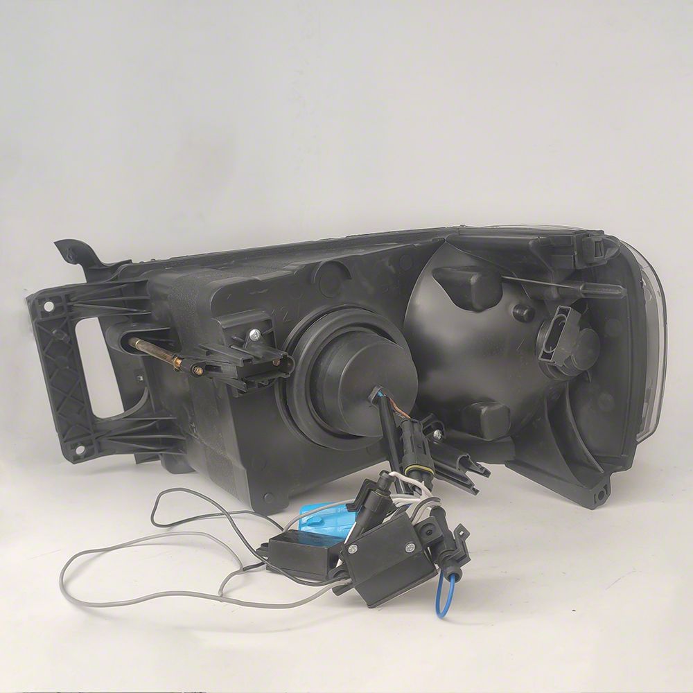 Raxiom Axial Series Projector Headlights with LED Bar; Black Housing; Clear Lens (03-05 RAM 3500)